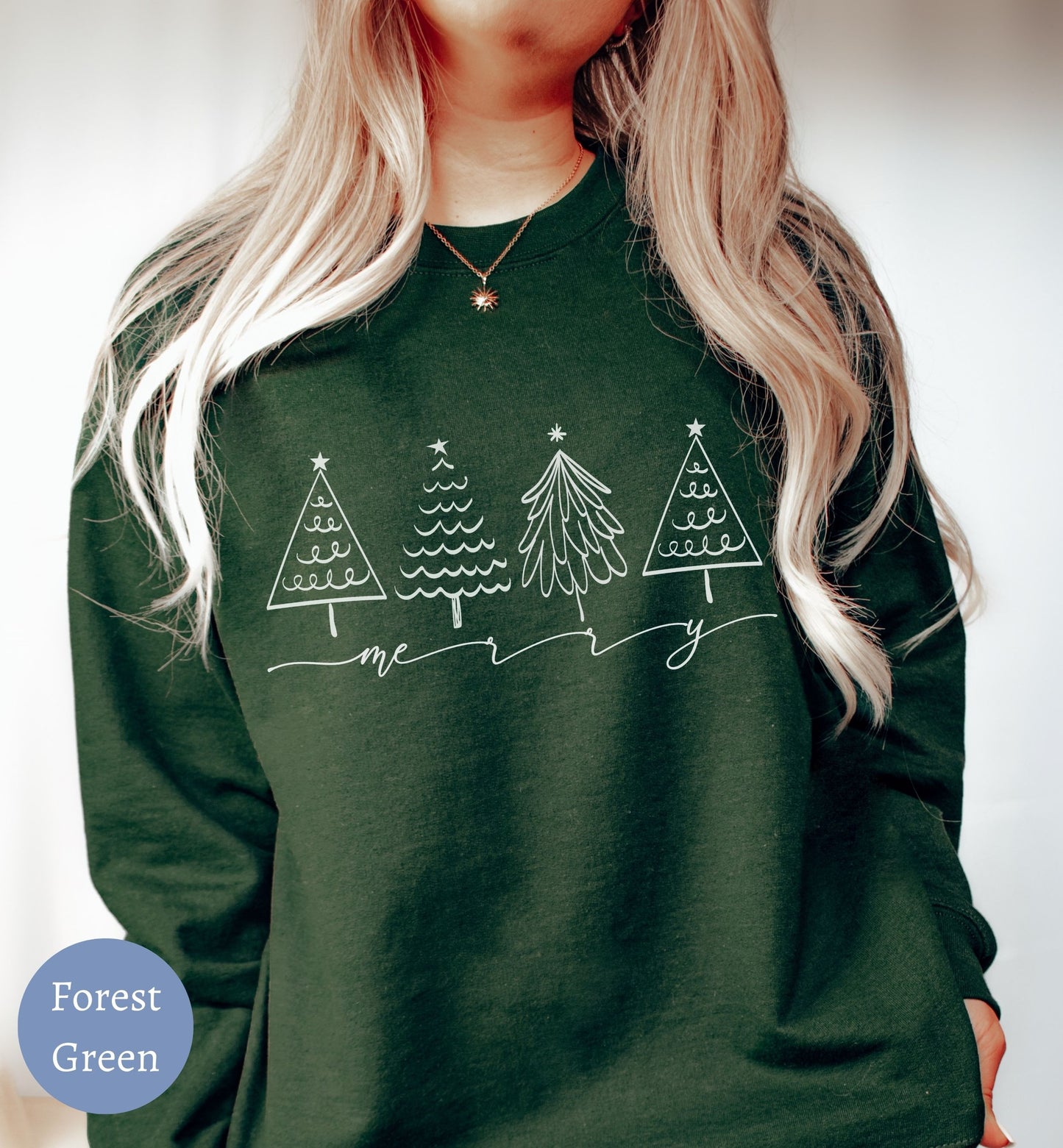 a woman wearing a forest green christmas sweater