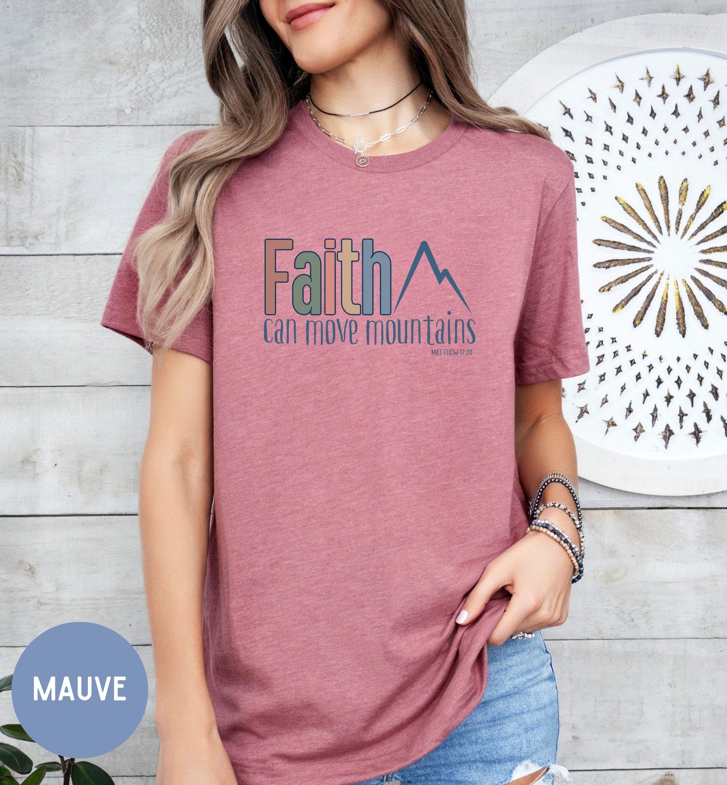 a woman wearing a t - shirt with the words faith on it