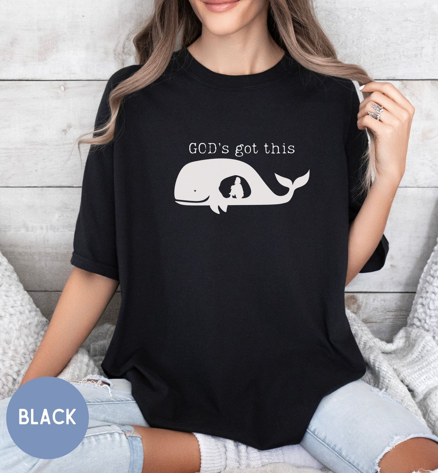 a woman wearing a black shirt that says god's got this