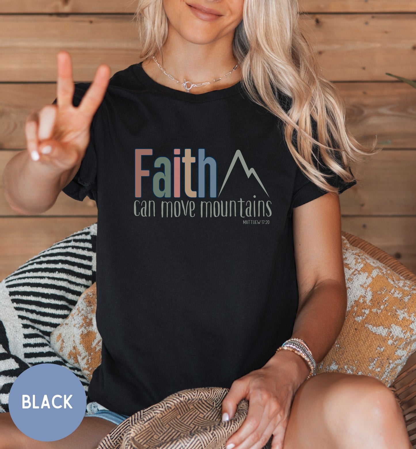 a woman sitting in a chair with a peace sign