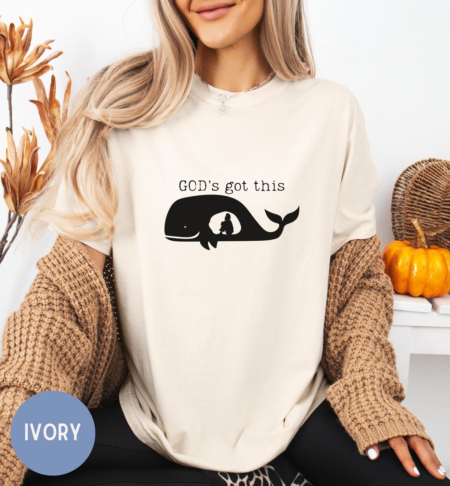 a woman wearing a t - shirt that says god's got this