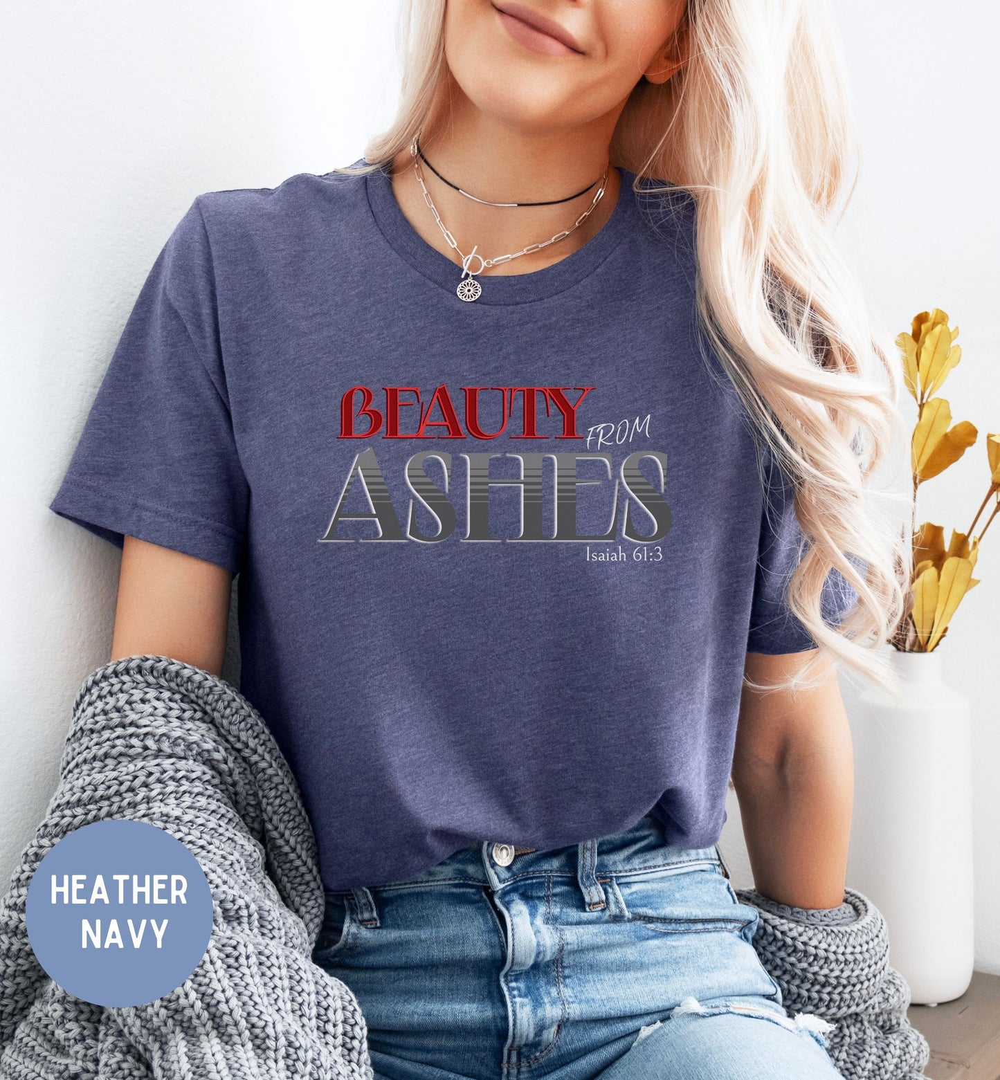 a woman wearing a t - shirt that says beauty from ashes