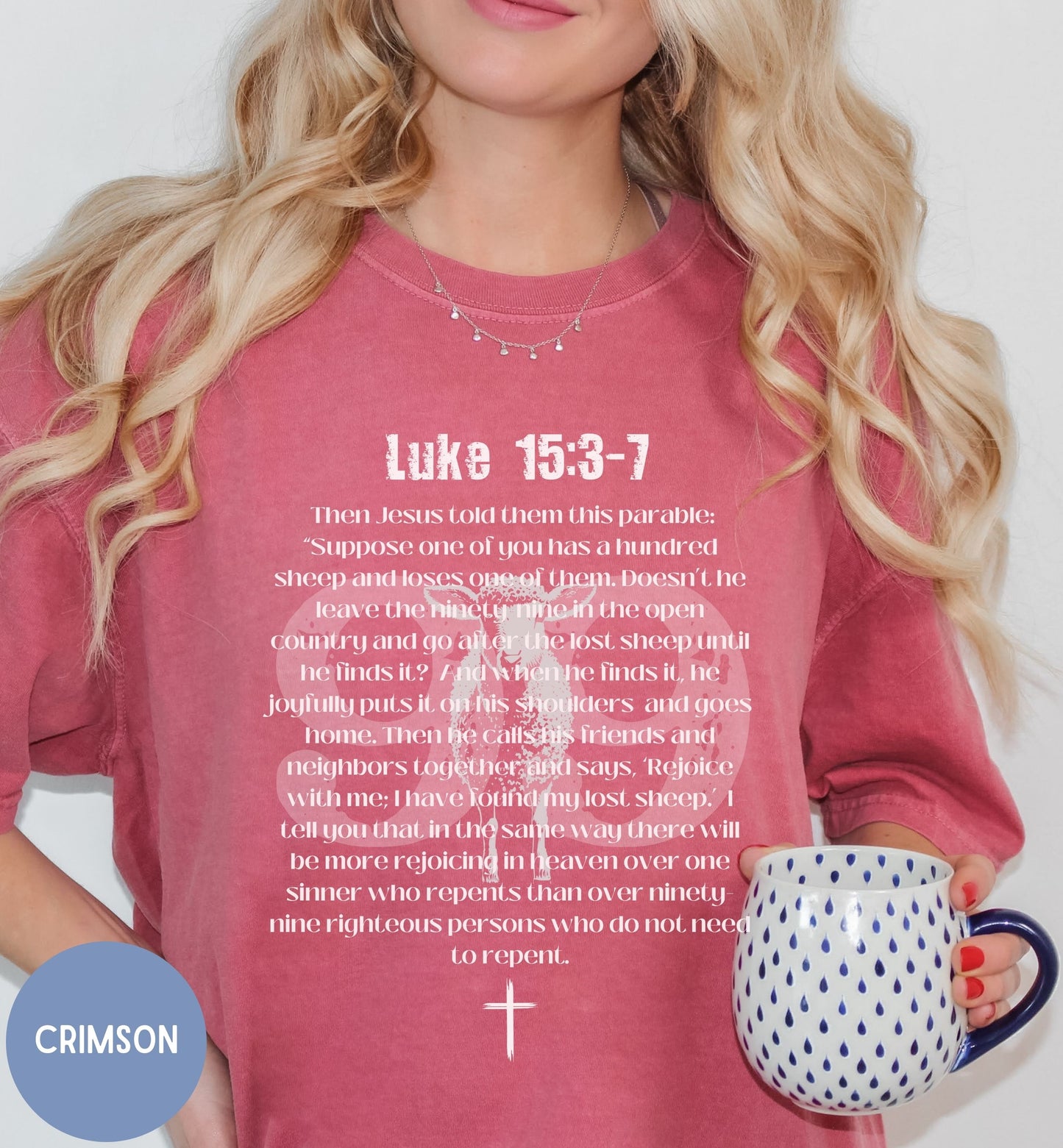 a woman holding a mug and a bible t - shirt