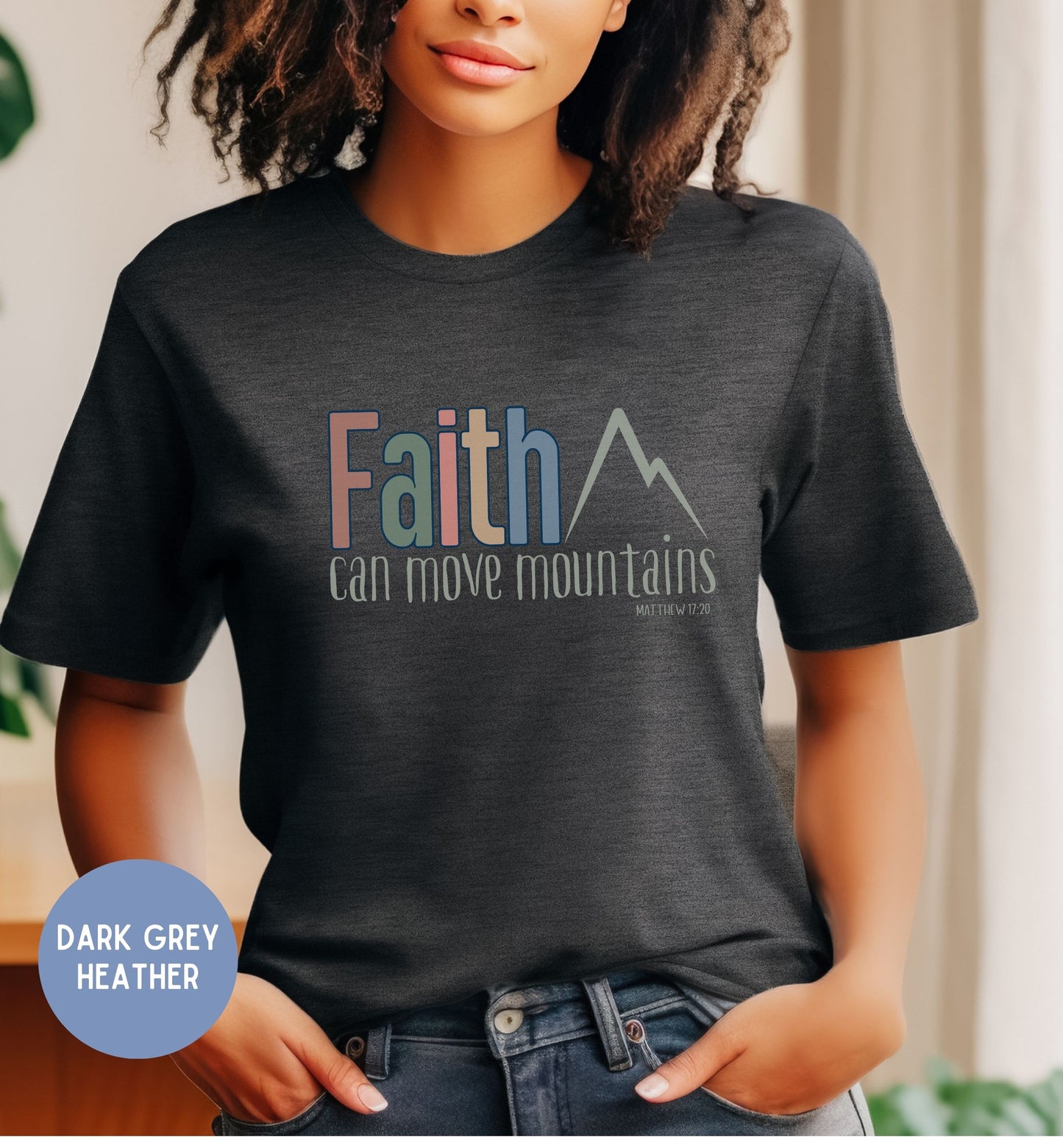 a woman wearing a t - shirt that says faith can move mountains