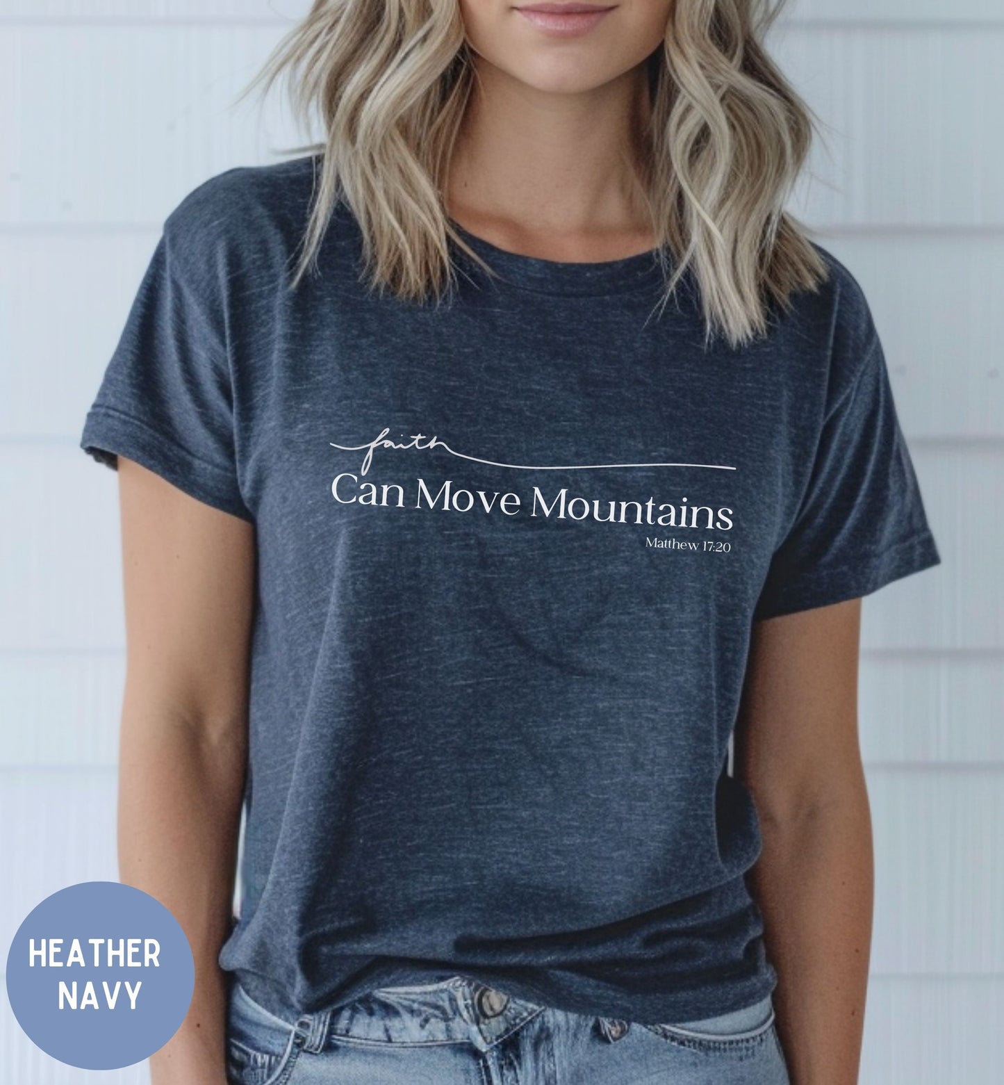 a woman wearing a t - shirt that says can move mountains