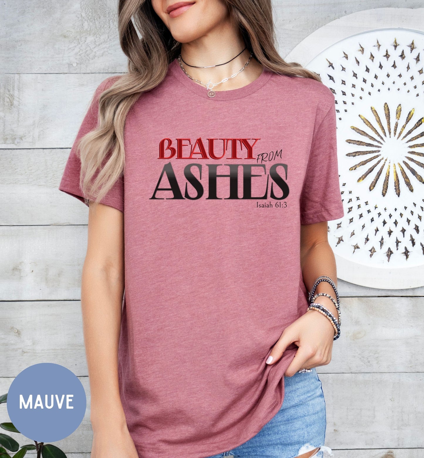 a woman wearing a t - shirt that says beauty from ashes