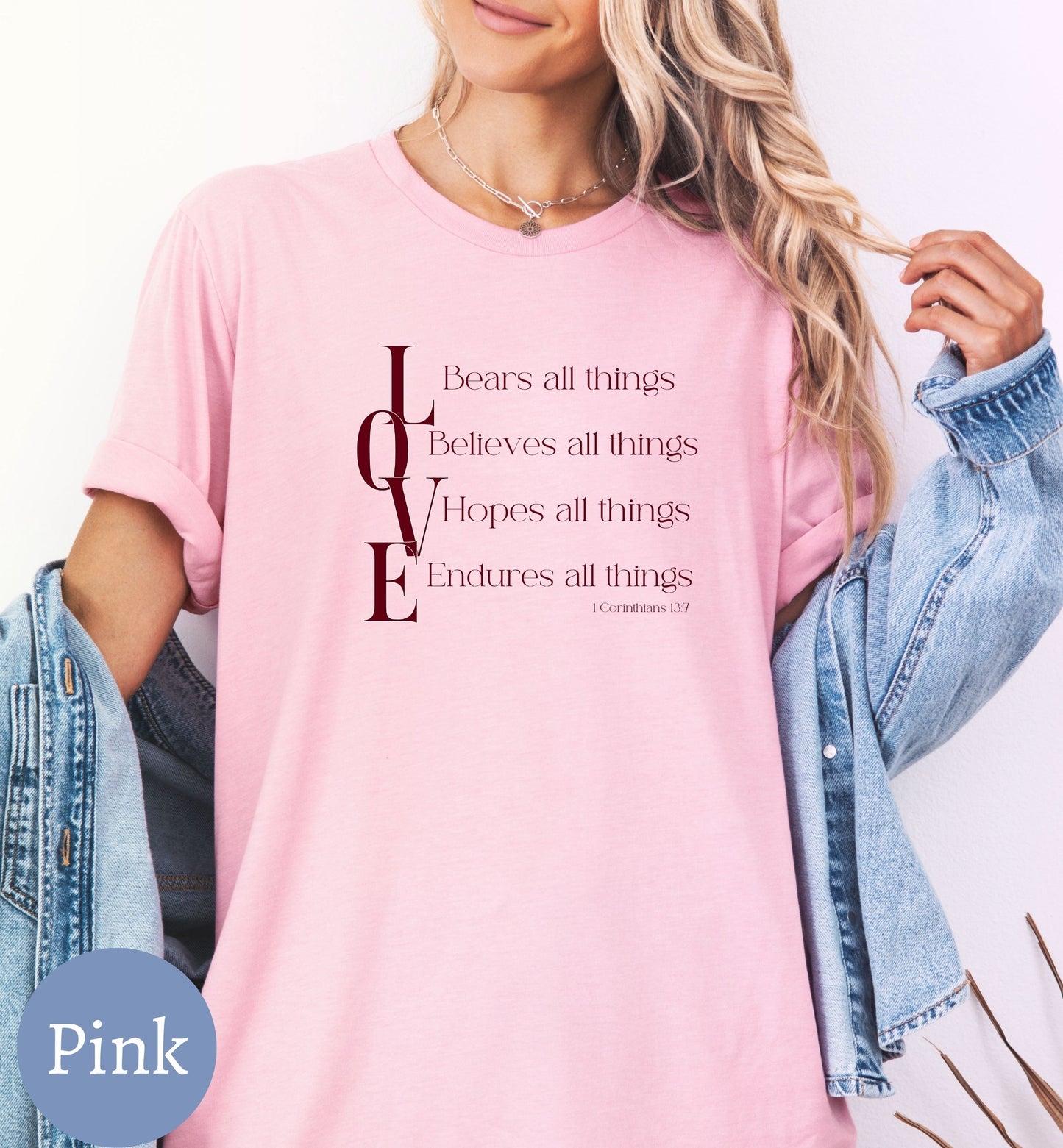 a woman wearing a pink t - shirt with a quote on it