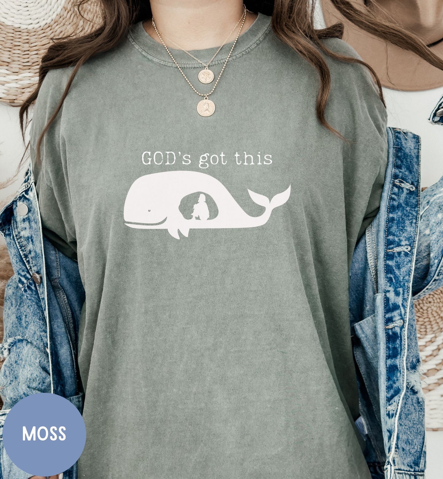 a woman wearing a shirt that says god's got this