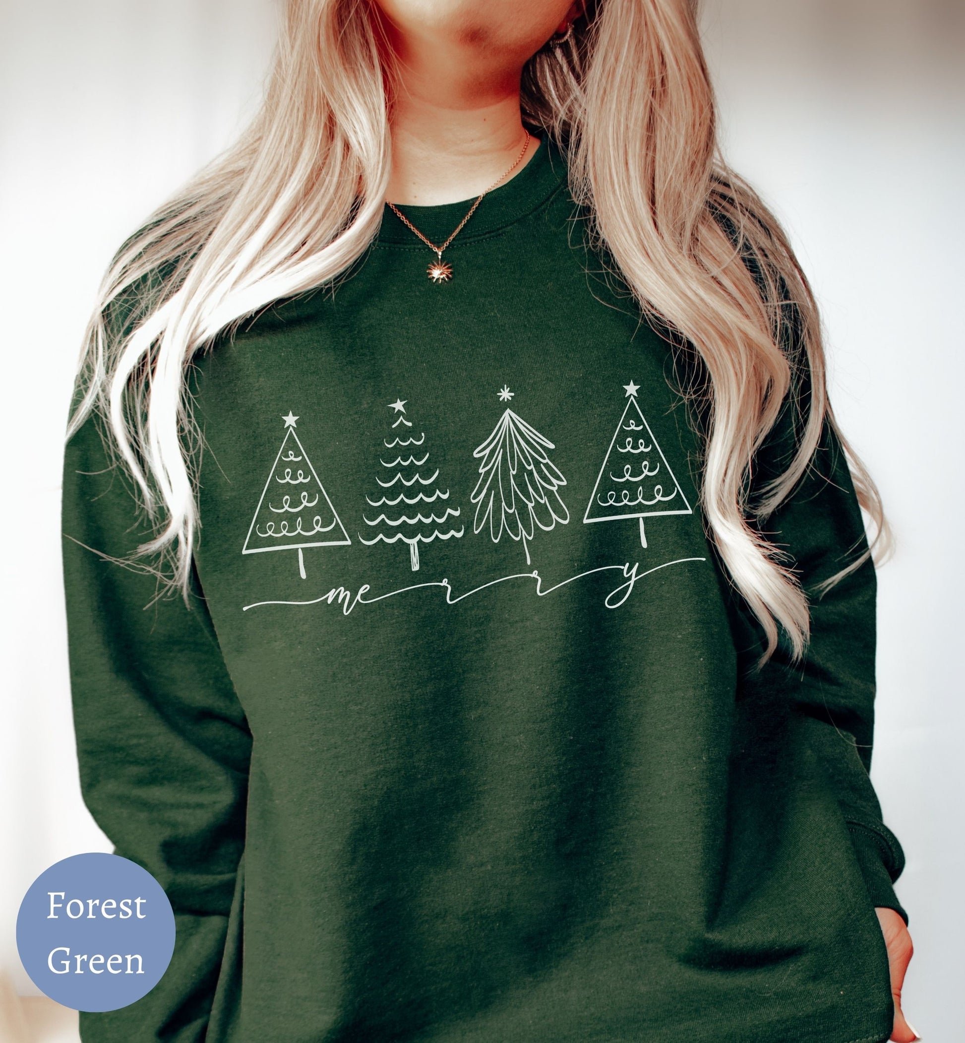 a woman wearing a forest green christmas sweater