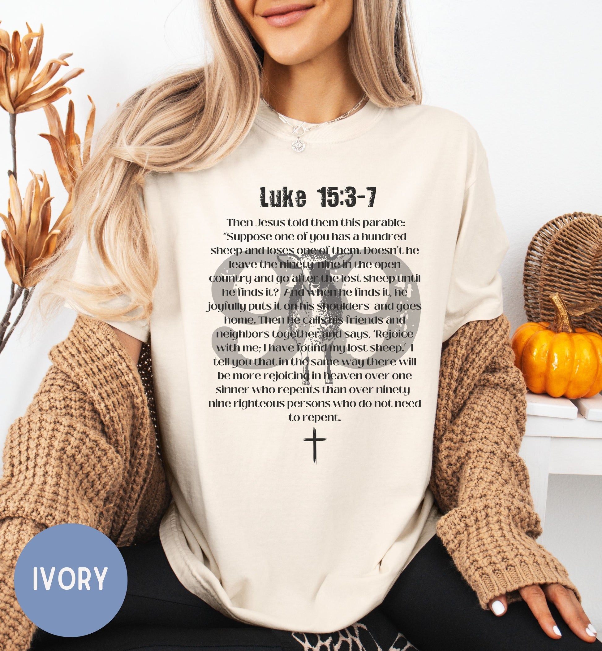 a woman wearing a t - shirt with a bible verse on it