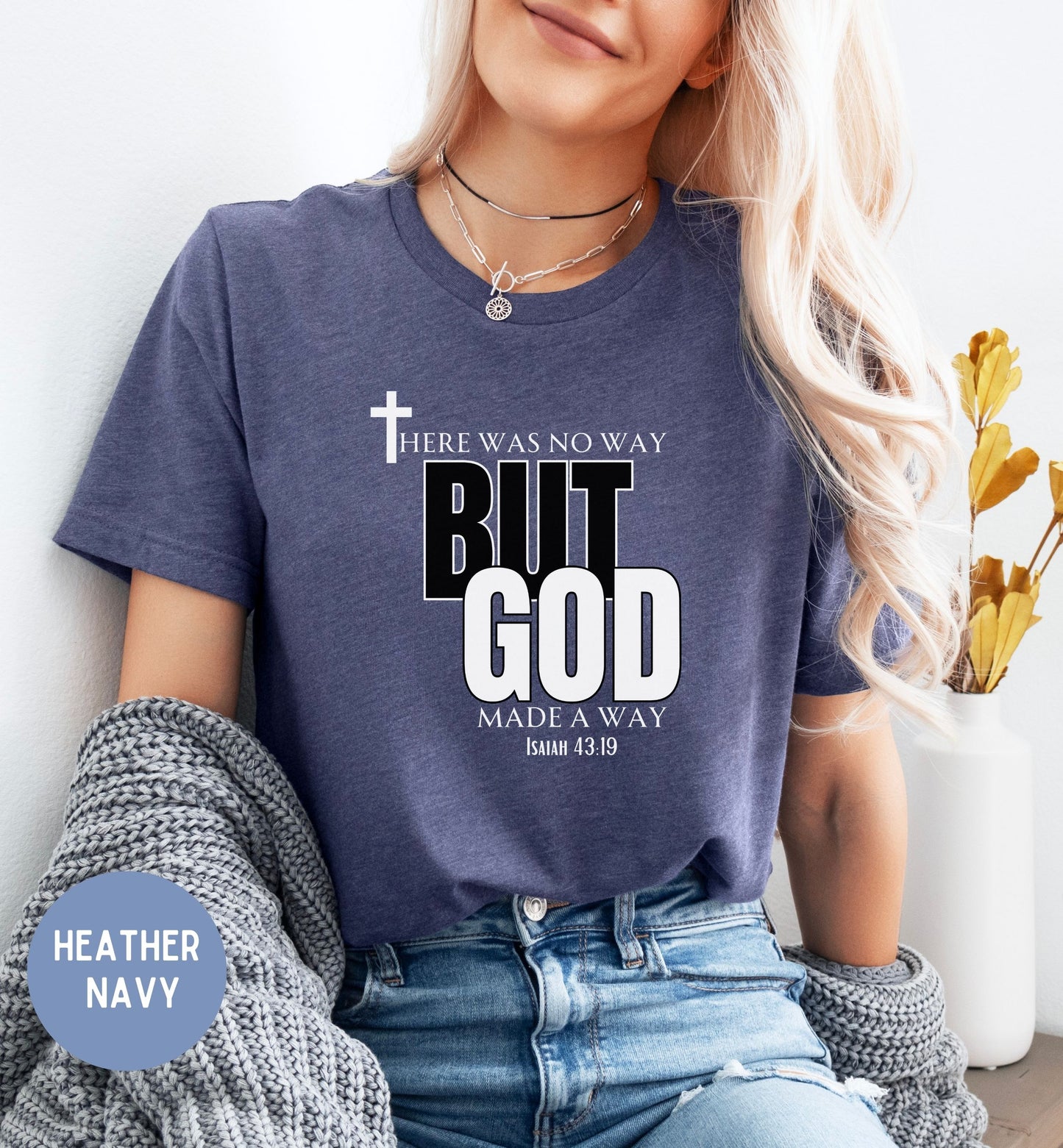 a woman wearing a t - shirt that says, the woman way but god makes