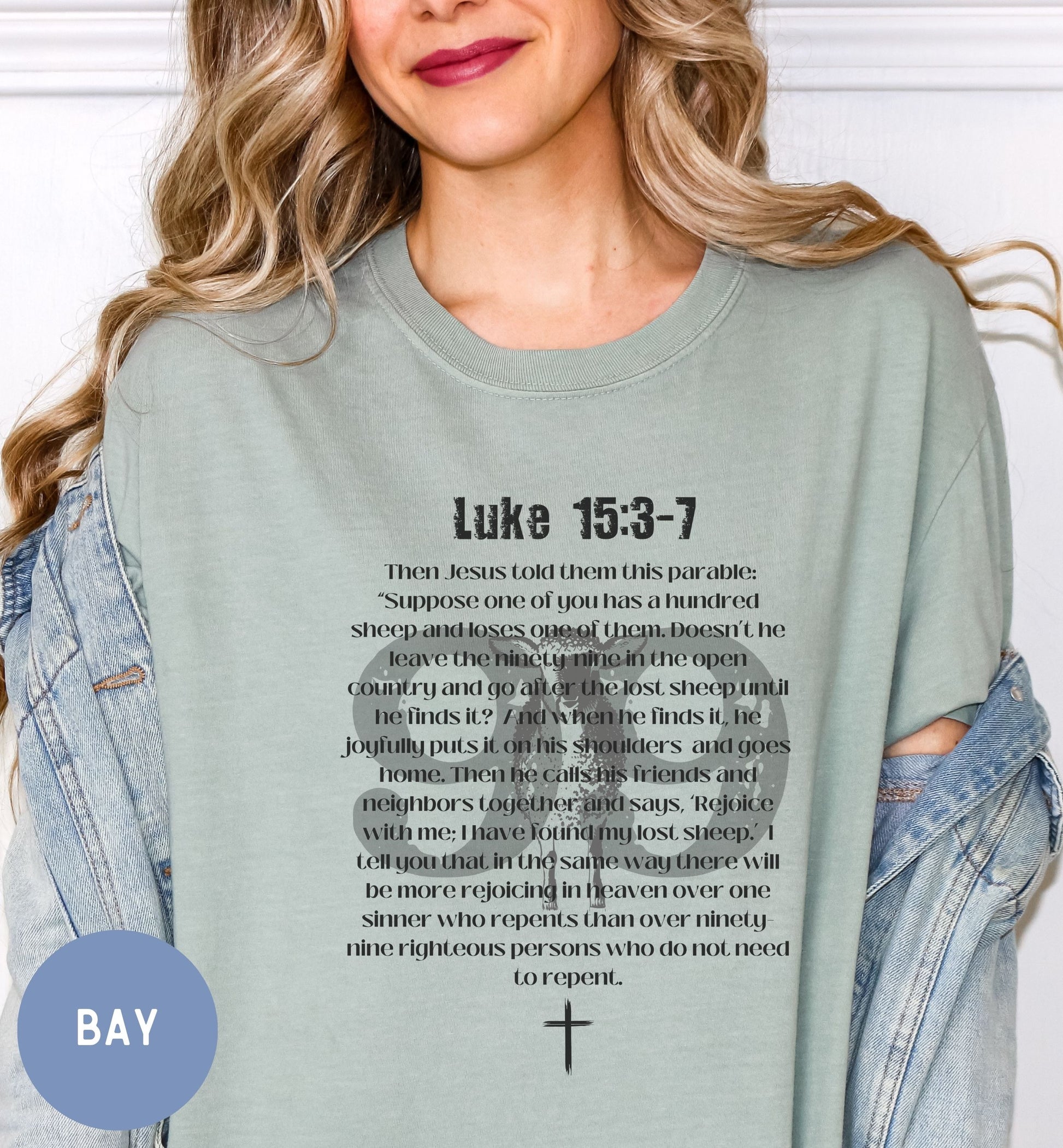 a woman wearing a t - shirt with the words luke 13 - 7 printed on